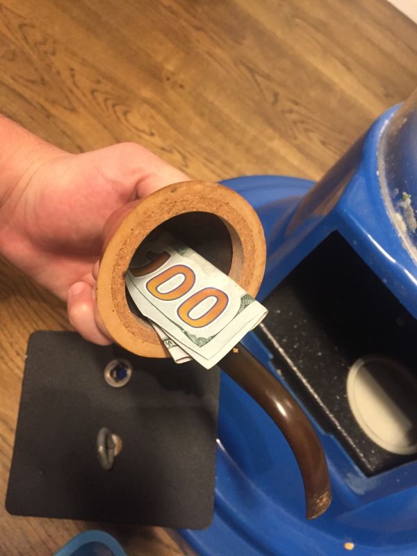 Pipe inside with 100 bucks! Why do people keep trying to stick c-notes inside coin slots?