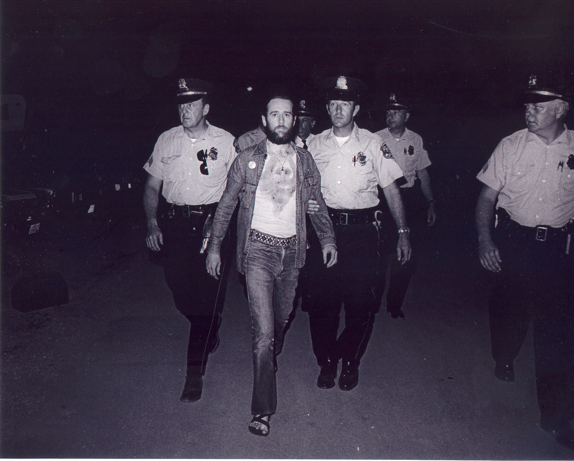 George Carlin being arrested for performing his bit "7 Words You Can Never Say on Television", 1972.