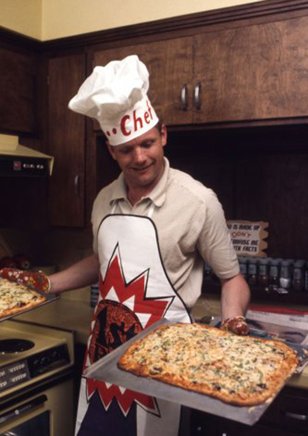 Commander Neil Armstrong making pizza at his home a few months before walking 

on the moon (1969).