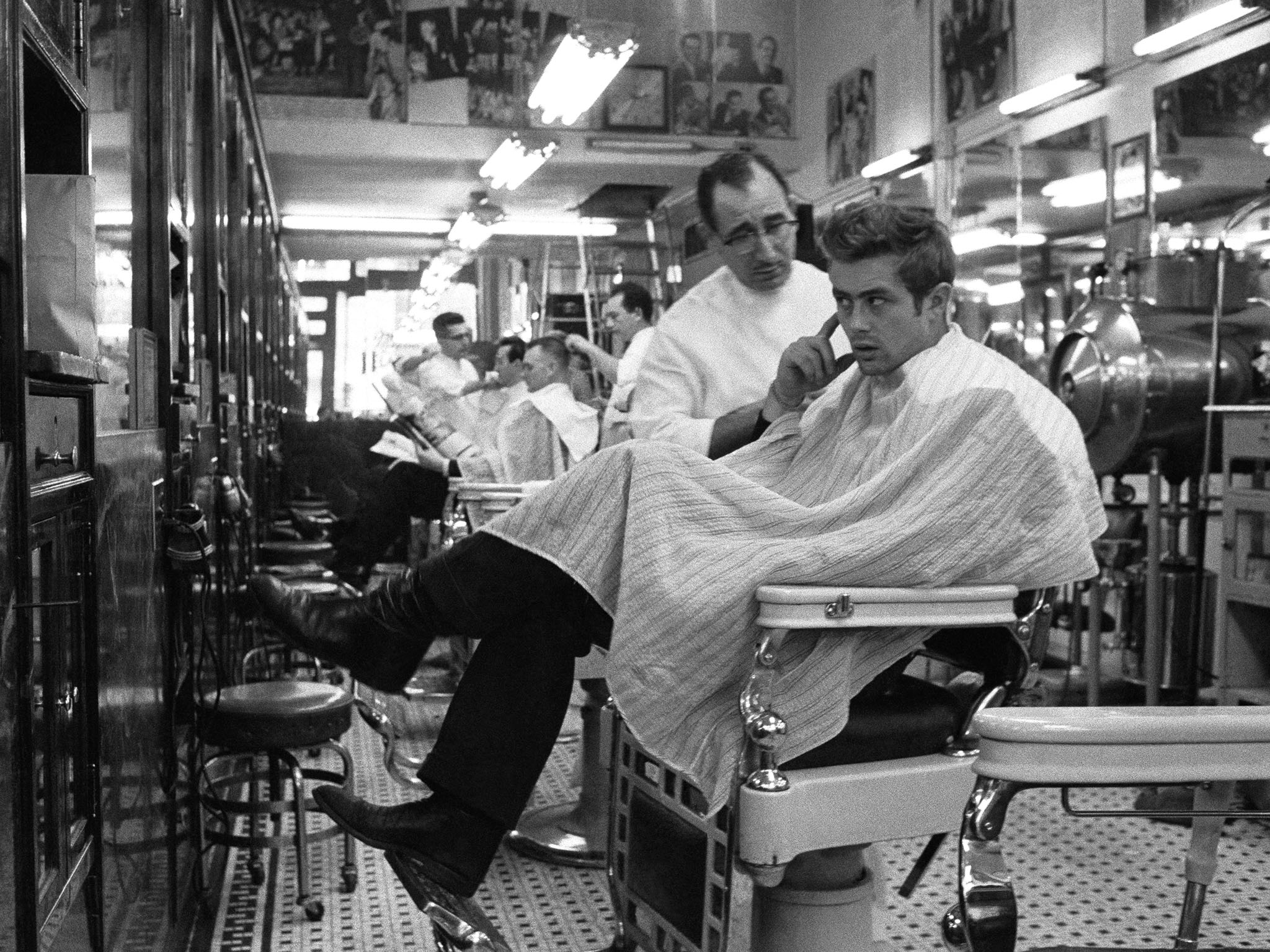 James Dean making sure it's perfect in a New York Barbershop, 1955.