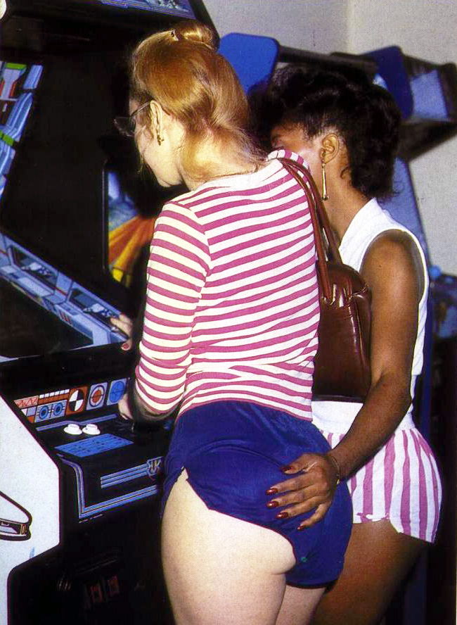 Gamer chicks at a game arcade.