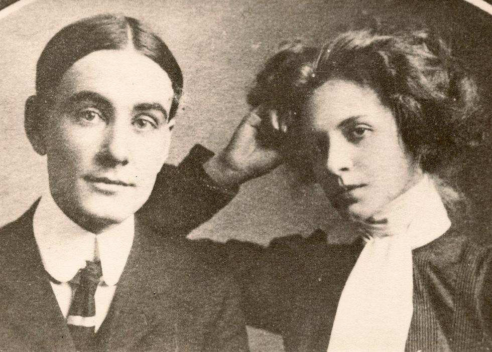 A couple posing for a photograph circa 1900.