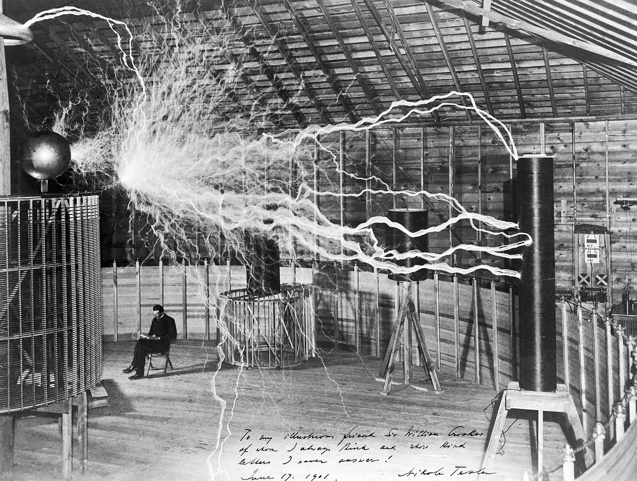 Nikola Tesla sitting in his Colorado Springs lab (1900s).