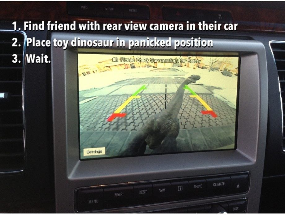 rear view camera funny - Setup Set 1. Find friend with rear view camera in their car 2. Place toy dinosaur in panicked position 3. Wait. Please Check Surroundings for Safety Settings Phone Climate Dest Nay Map Menu Oup