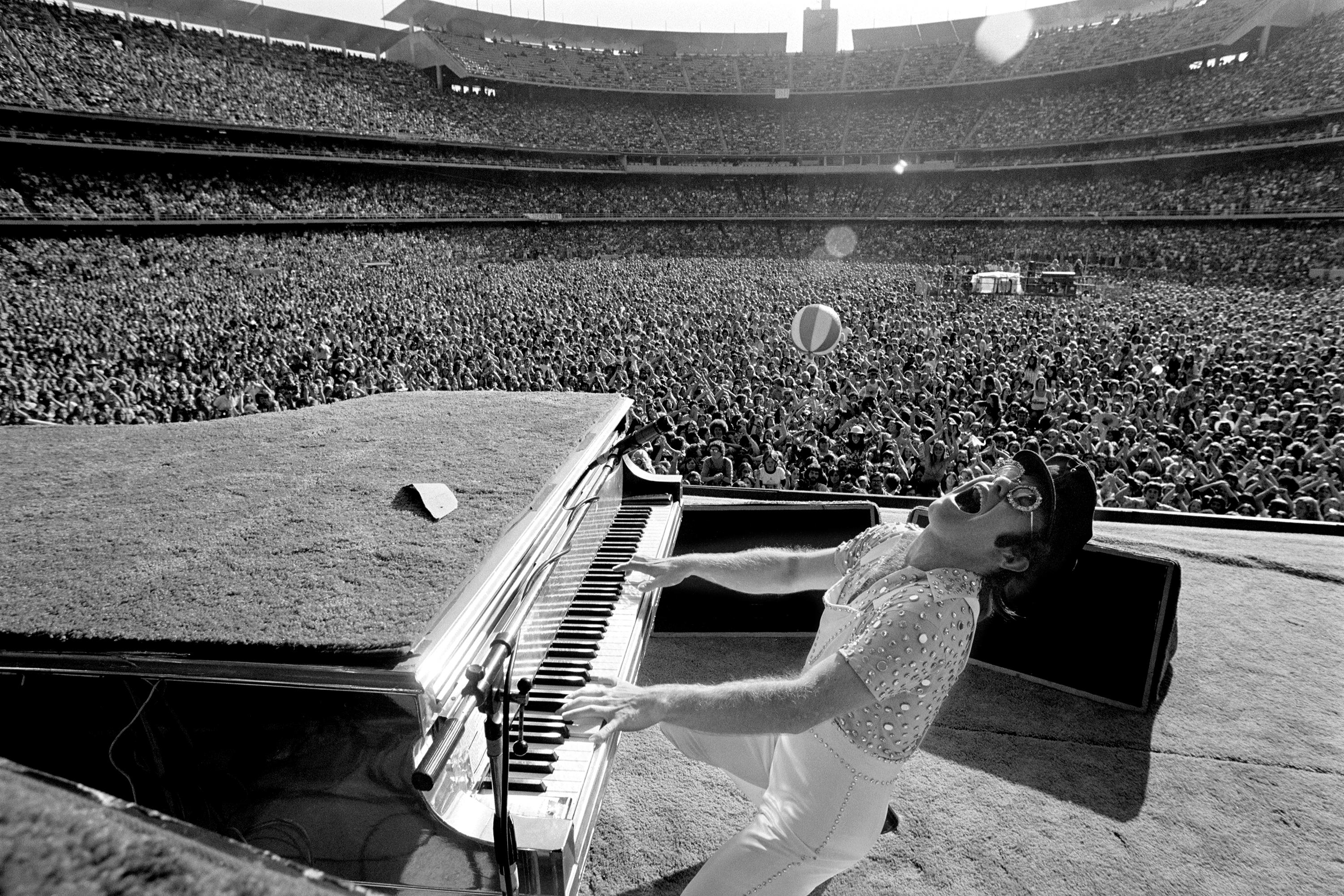 Elton John rocking out at Dodger Stadium in Los Angeles, October 1975.