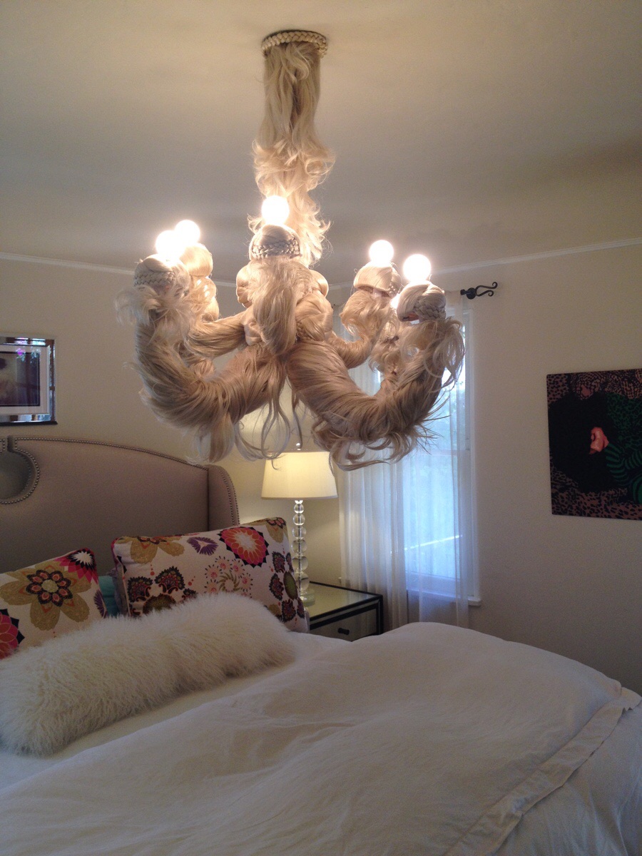 Creepy chandelier made out of doll hair.