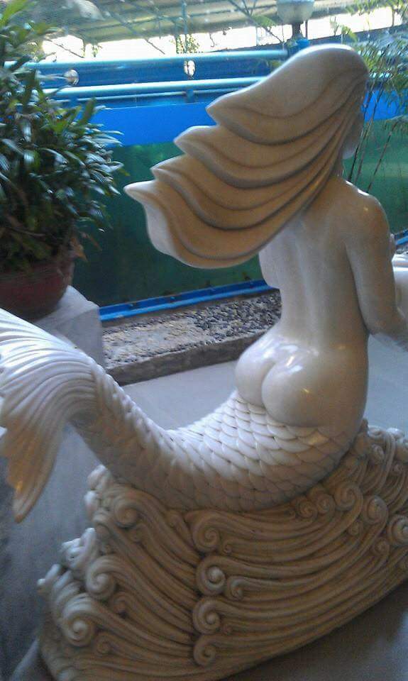 mermaid butt statue