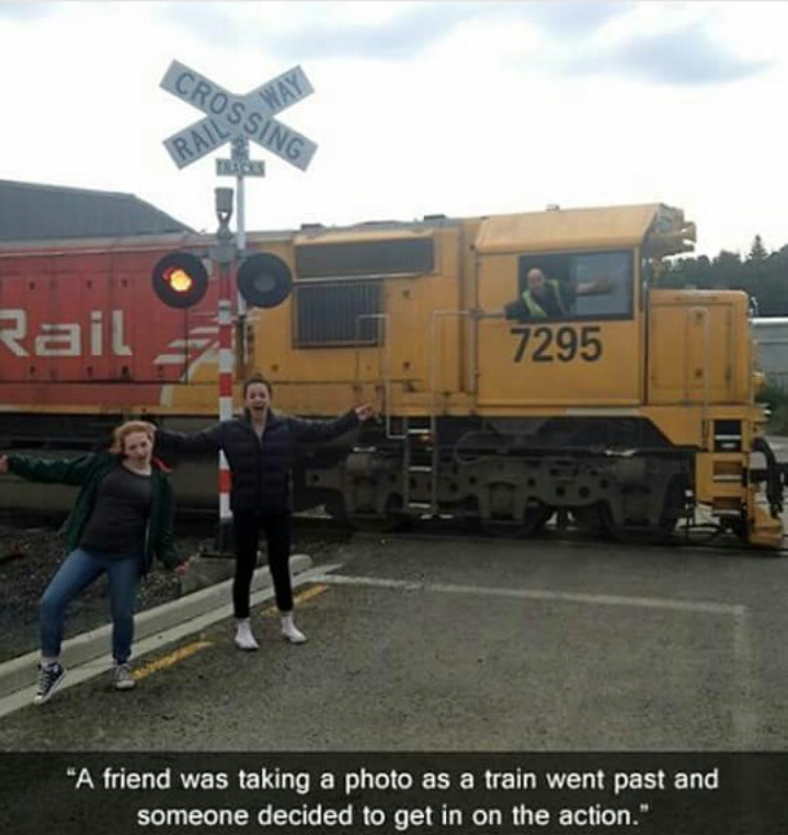 train photobomb - Crossing Rail 7295 "A friend was taking a photo as a train went past and someone decided to get in on the action."