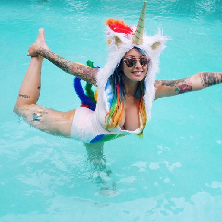 woman in a pool wearing a unicorn costume