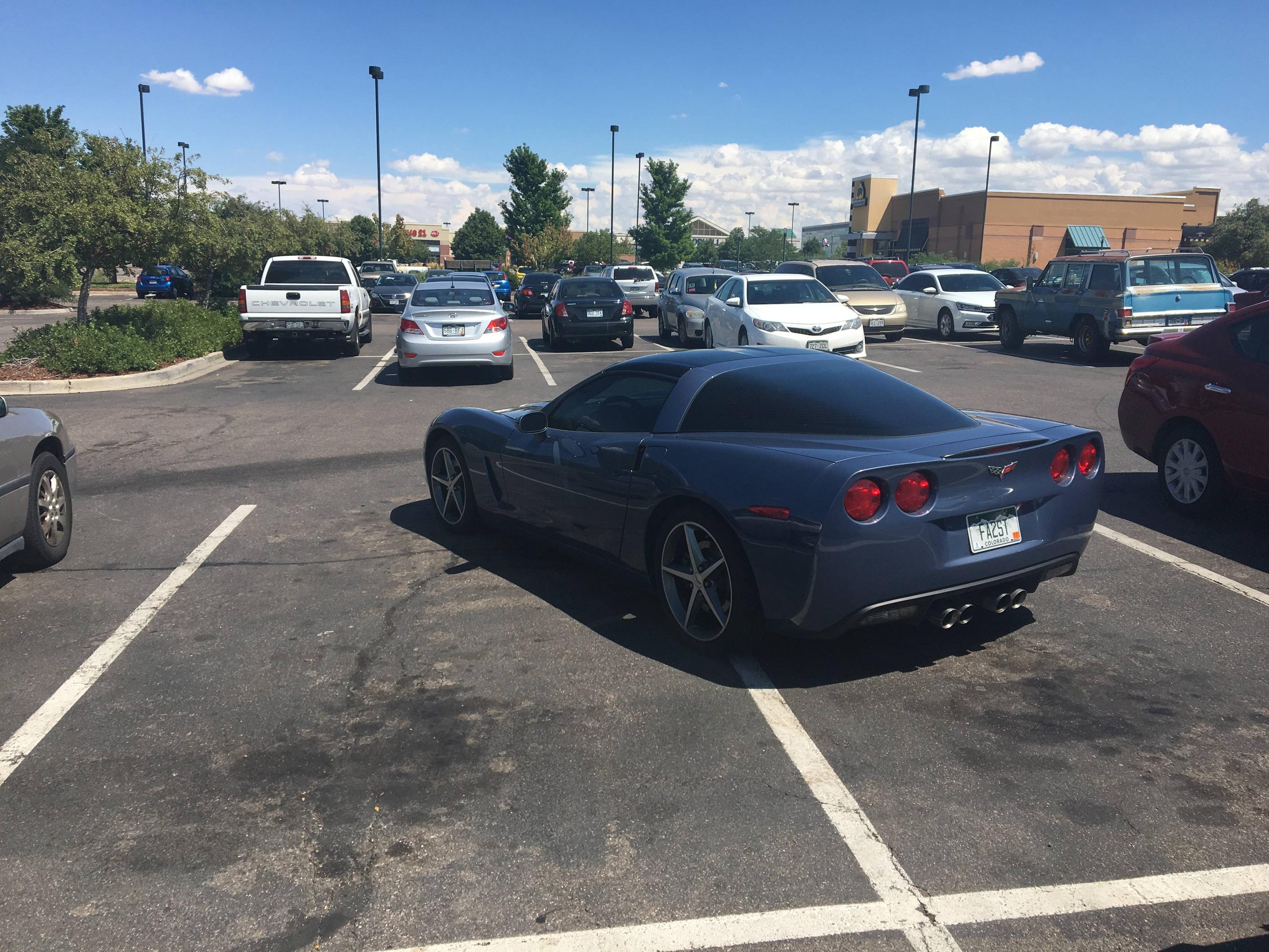 Corvette parked in a way that he is taking up 2 spots
