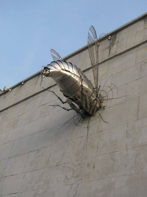 funny picture of a metal bug that smashed into the brick wall