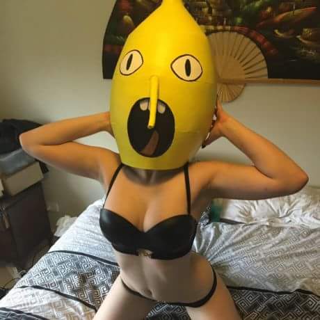 Funny picture of girl in lingerie wearing funny inflatable mask