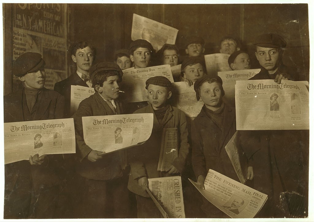 Paper boys at 2 A.M. about to start their morning rounds. February 12, 1908.