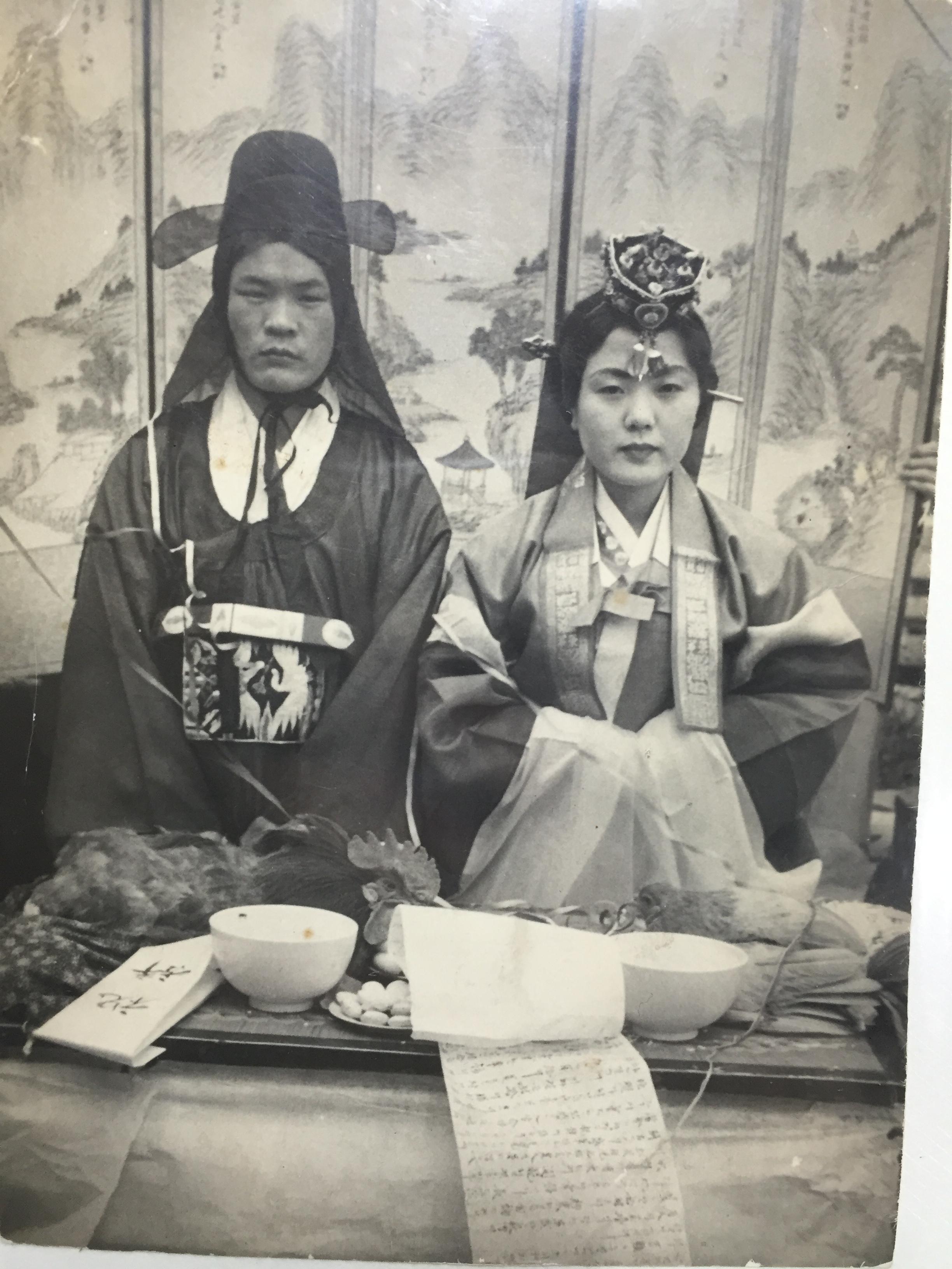 Korean couple on their traditional wedding in 1950's.