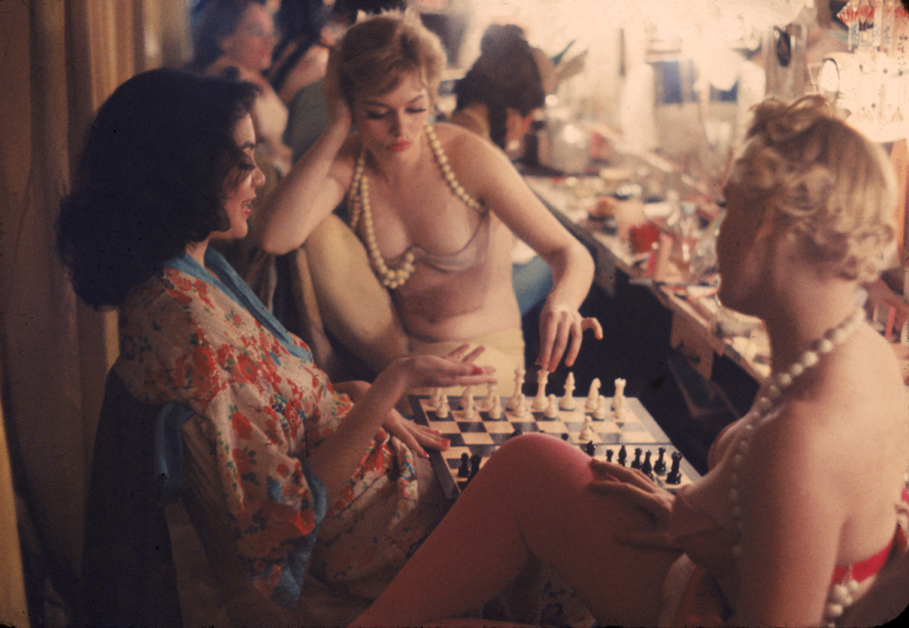 Showgirls playing chess backstage at the Latin Quarter nightclub - New York, 1958.