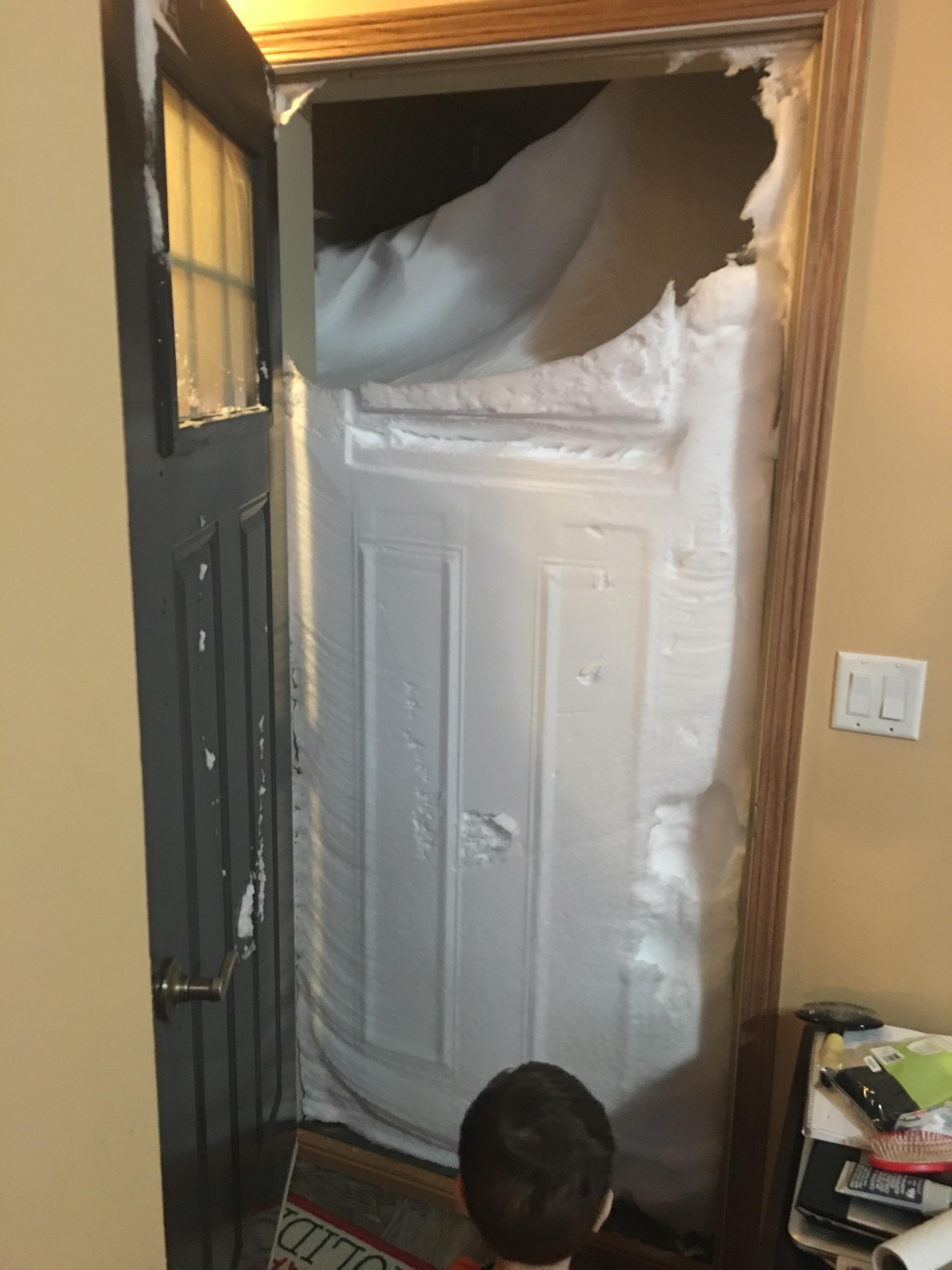 snow covering a door