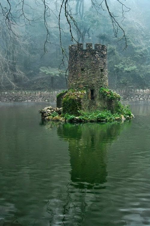 castle in the middle of a lake - W