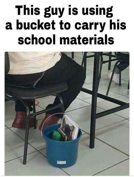 This guy is using a bucket to carry his school materials