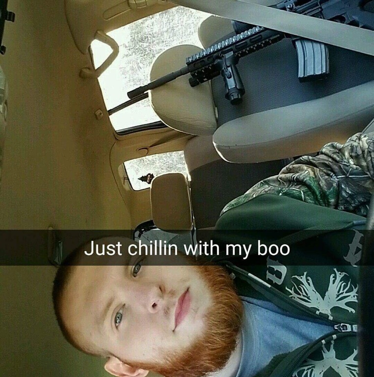 Snapchat of a neckbeard chilling with his Boo which looks like some kind of assault rifle.