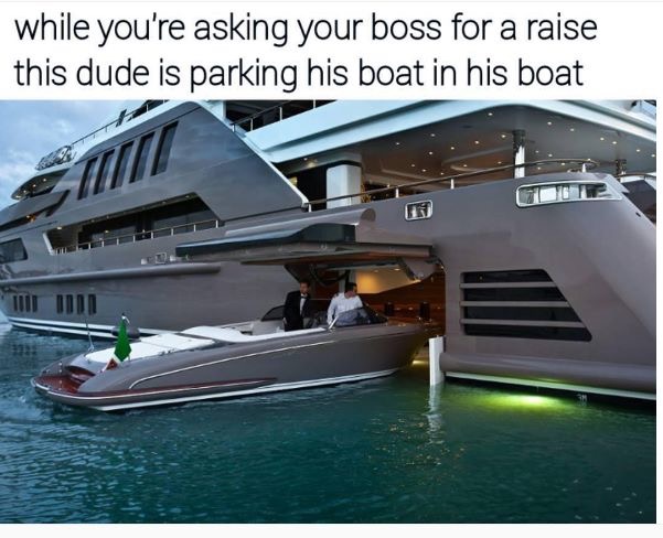 yacht with car garage - while you're asking your boss for a raise this dude is parking his boat in his boat