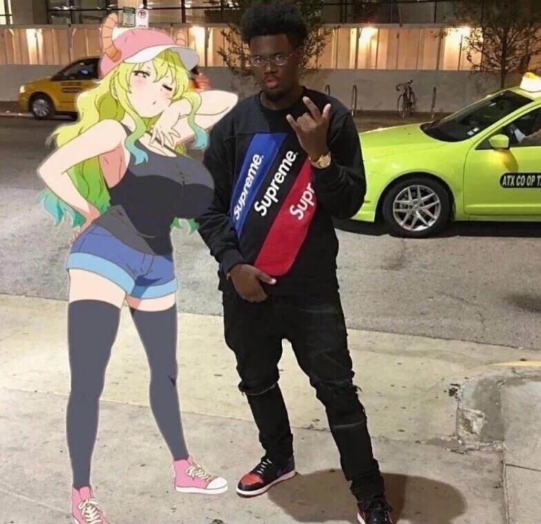 Dude posing with his make believe anime girlfriend.