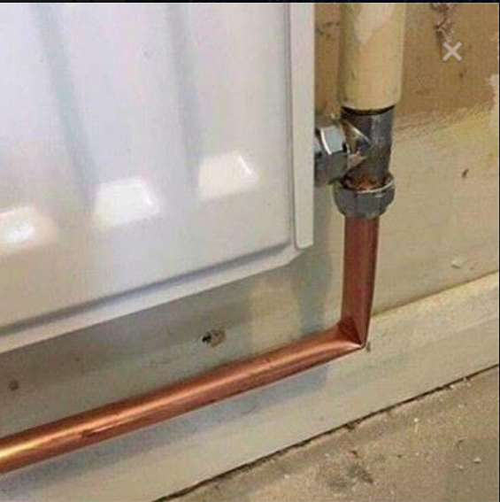 Cringeworthy copper tubing for a radiator that was clinched instead of evenly bent.