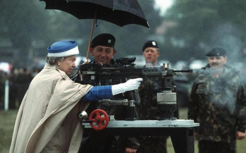 queen elizabeth shooting a machine gun