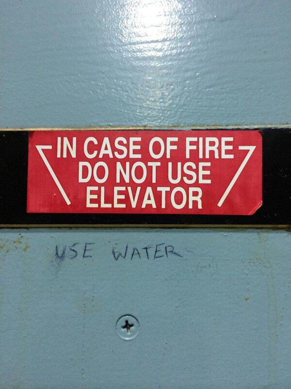 street sign - In Case Of Fire 7 Do Not Use Elevator i Use Water