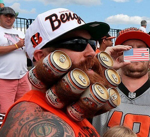 Picture of a man with a beer beard and a dude with an American flag cellphone case taking his pic