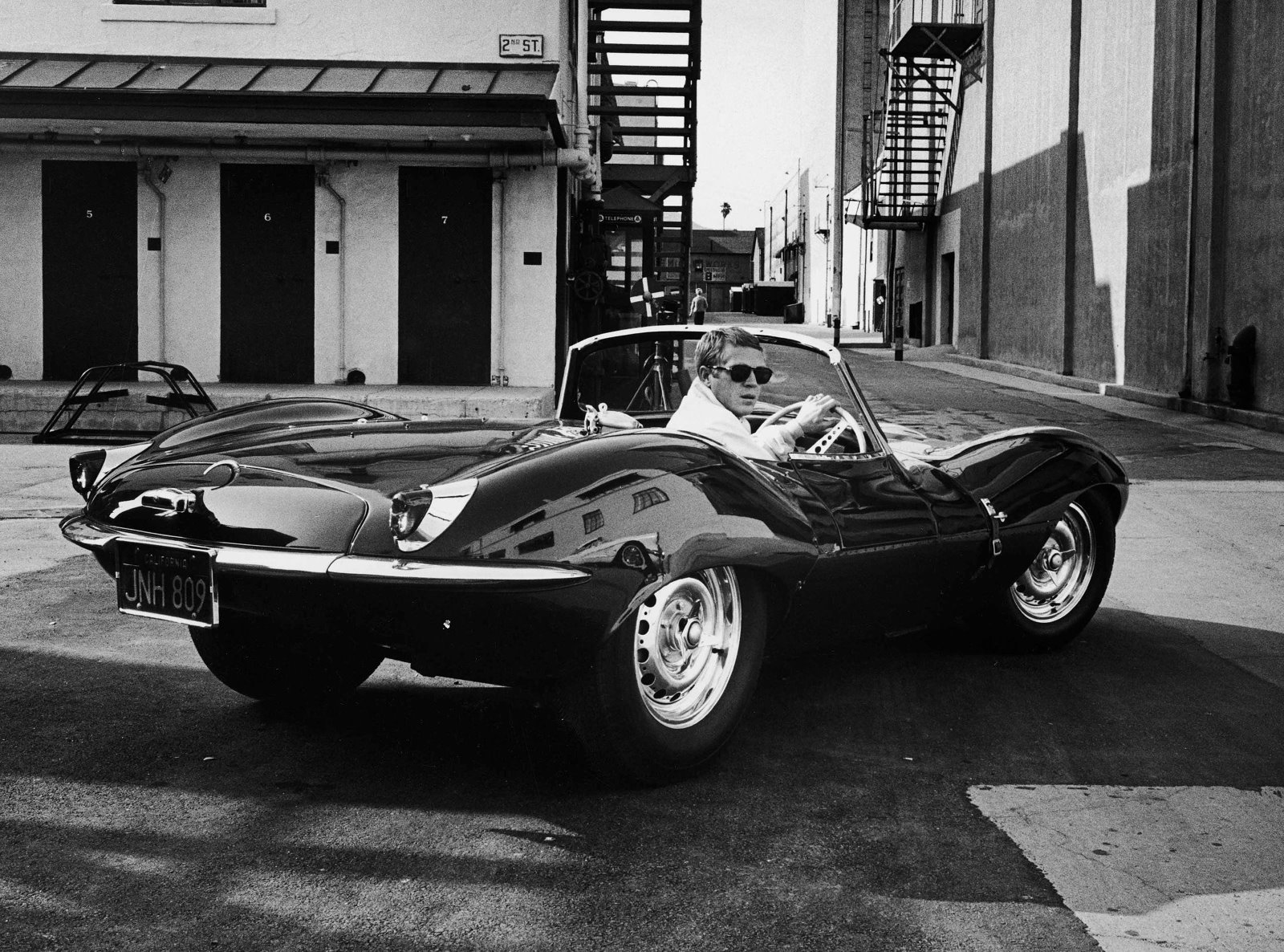 Steve McQueen in his Jaguar, 1963