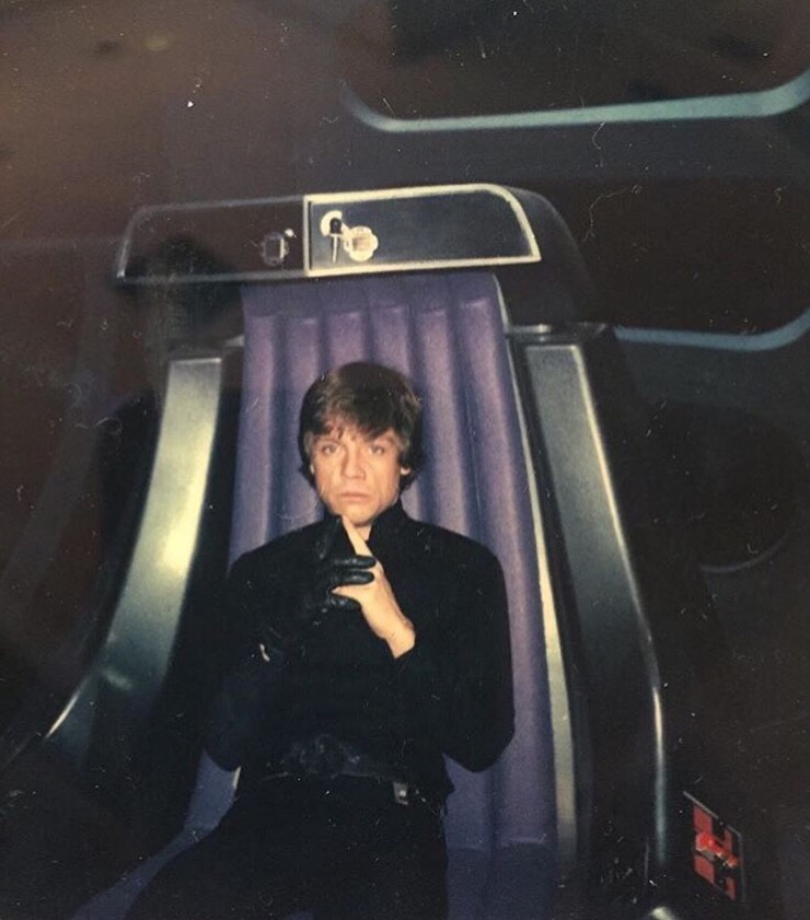Set photographs from Star Wars of Mark Hamill sitting in the emperor's chair.