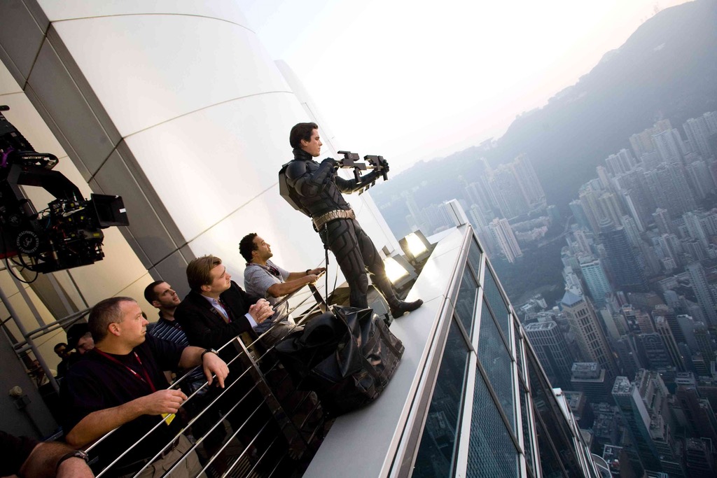 Christian Bale standing on a rooftop in Hong Kong for shooting the scene in Batman.