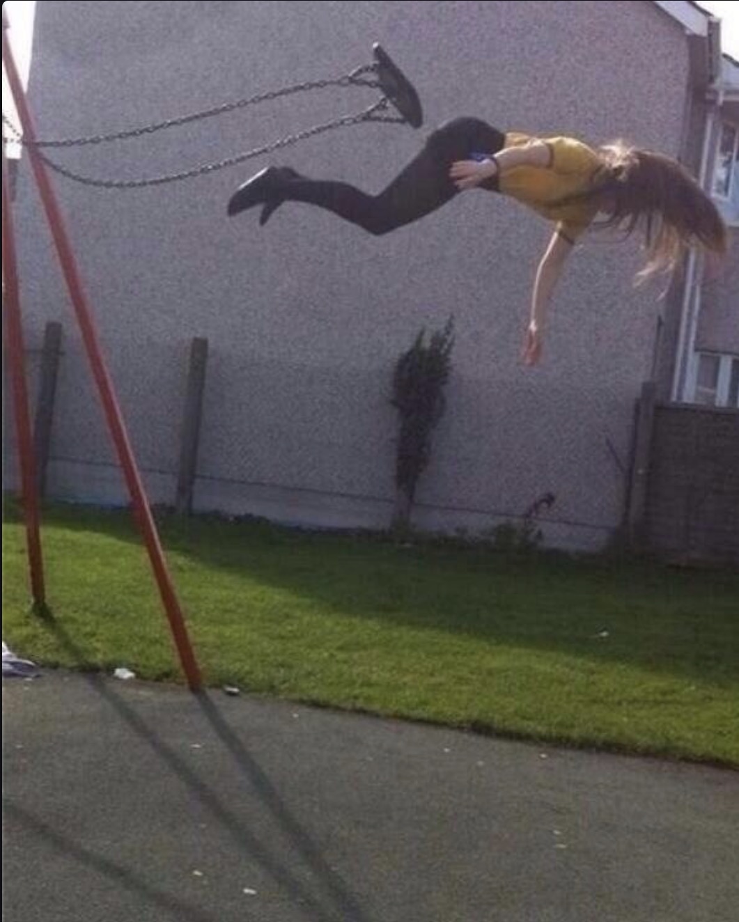 WTF image of someone loosing control on a swing.