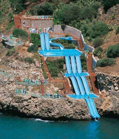 Elaborate waterslide built into the side of a mountain.