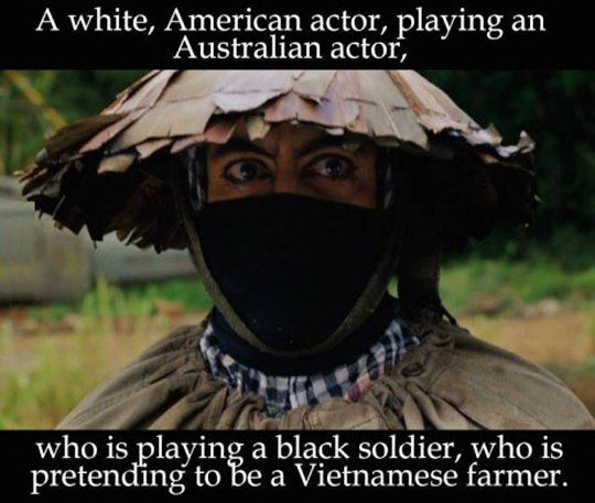 Funny meme of Robert Downey Jr. is a white American actor, playing an Australian actore who is playing a black soldier who is pretending to be a Vietnamese farmer from the movie Tropic Thunder