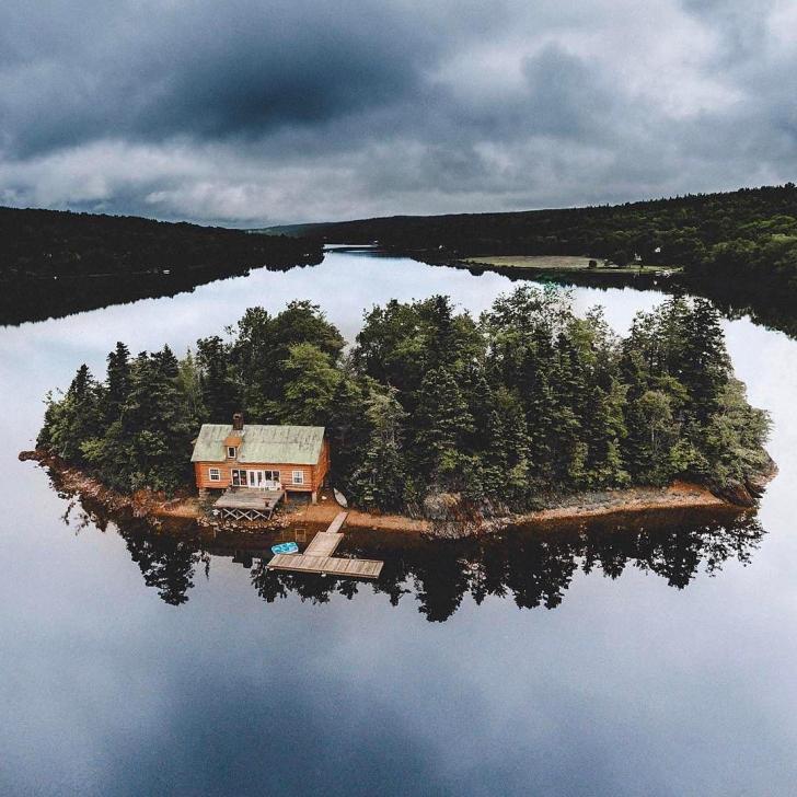 house on an island in a lake.