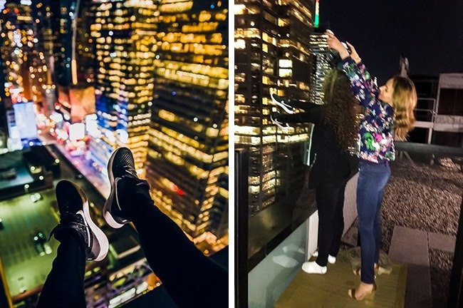 Woman took photo that looks like she is hanging off the side of a building but it is her hand with shoes and a friend taking the pic