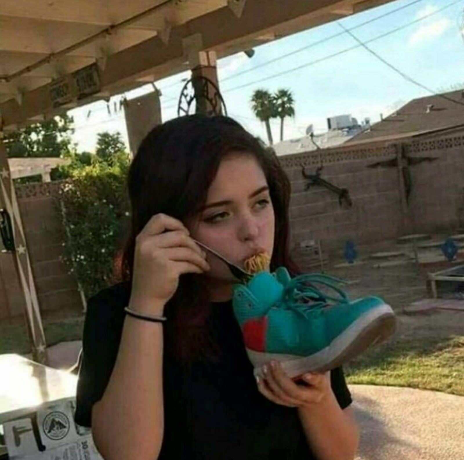 girl eating from shoe