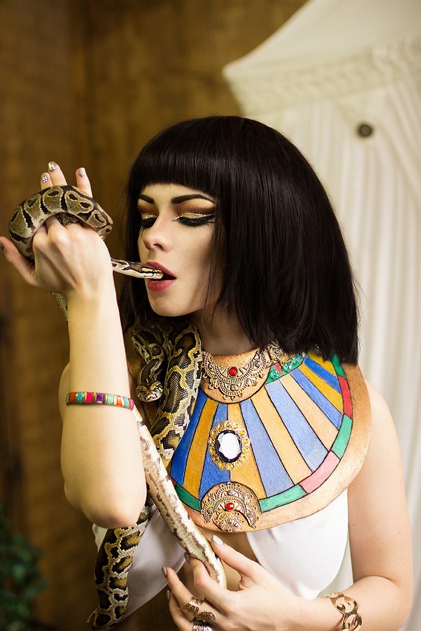 girl dressed like cleopatra with a snake