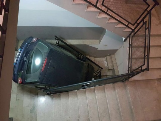 car driving down stairs