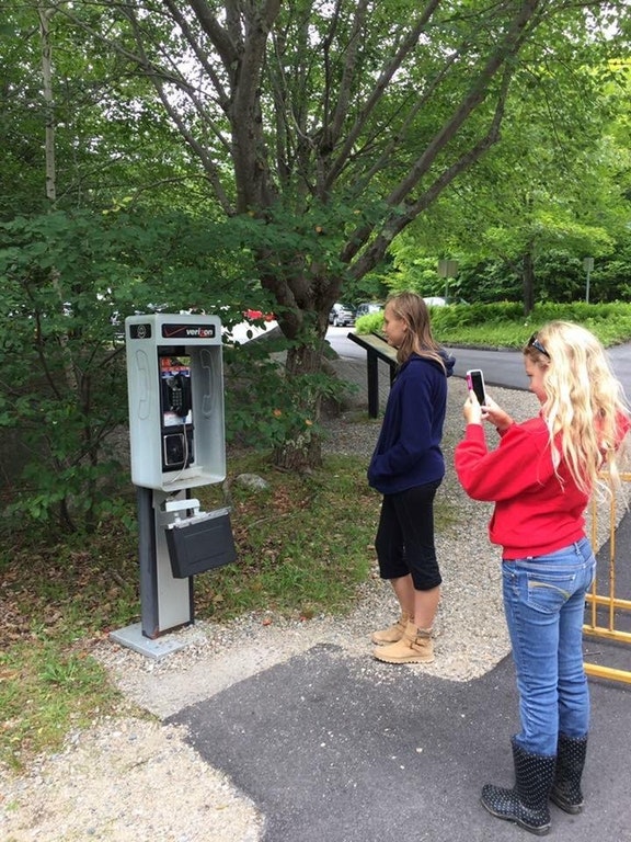 kids exploring ancient ruins phone booth