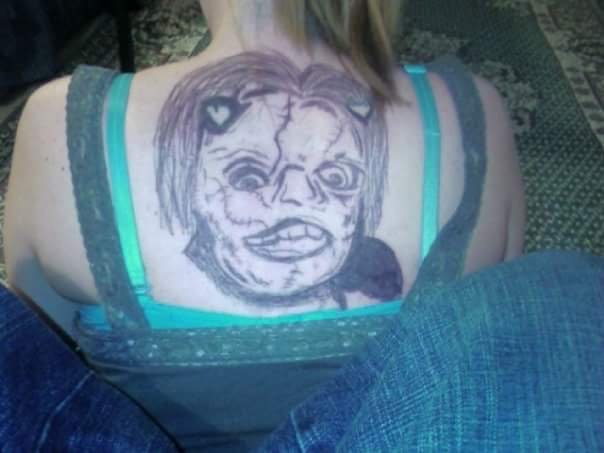 ugly tattoo on a woman's back