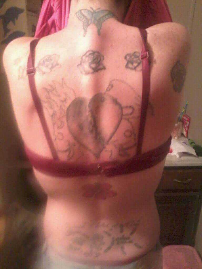 sloppy tattoos on a girl's back.