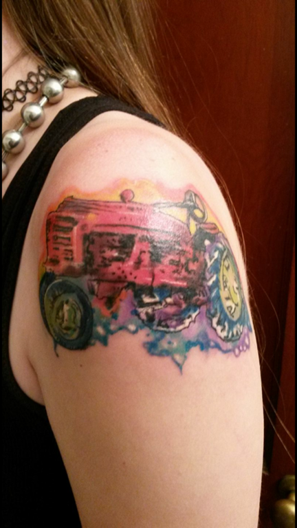 Tractor tattoo on a girl's arm.