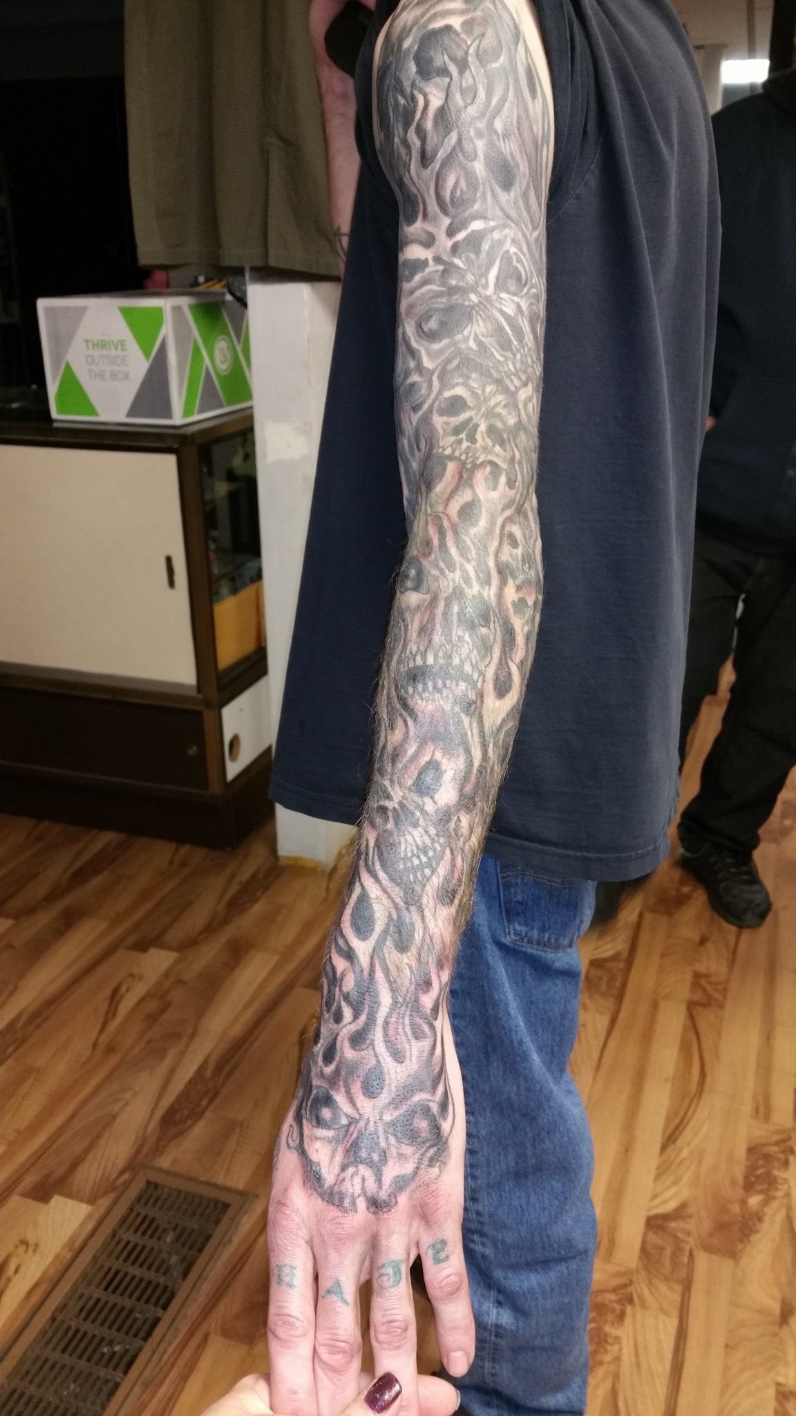 Tattoo all along a man's arm