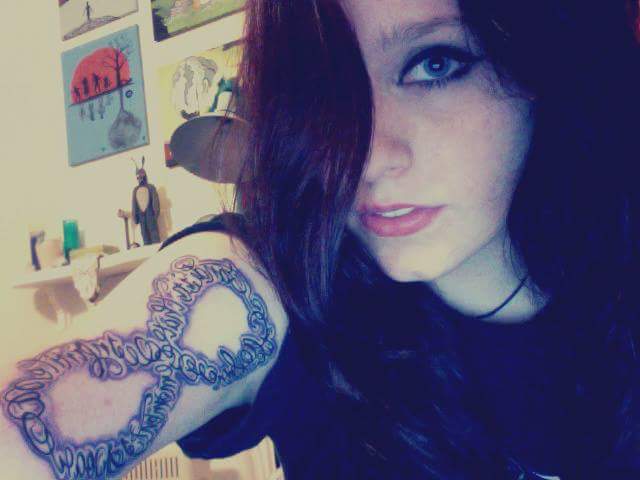 Girl with horrible infinity tattoo on her arm