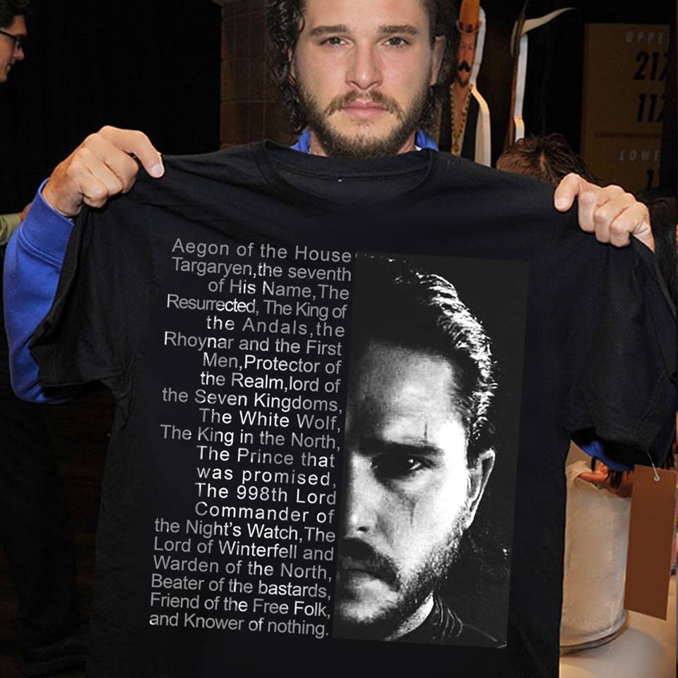 Kit Harrington holding a shirt with he proper title for Jon Snow on it.