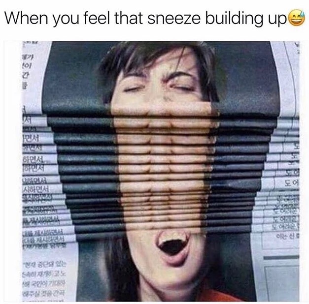 Woman sneezing on the cover of a newspaper and a stack of them make it look like the feeling of a sneeze building up.