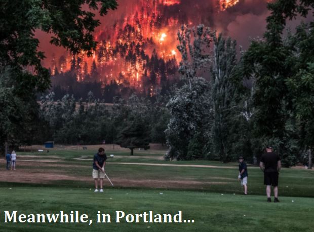 Picture of raging forest fire in the background of a lushes golf course with caption Meanwhile in Portland
