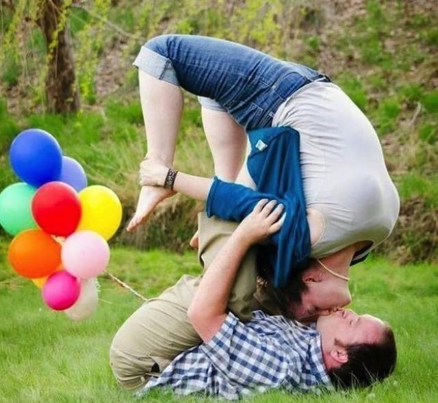 funny picture of couple doing some kind of weird backwards yoga kiss